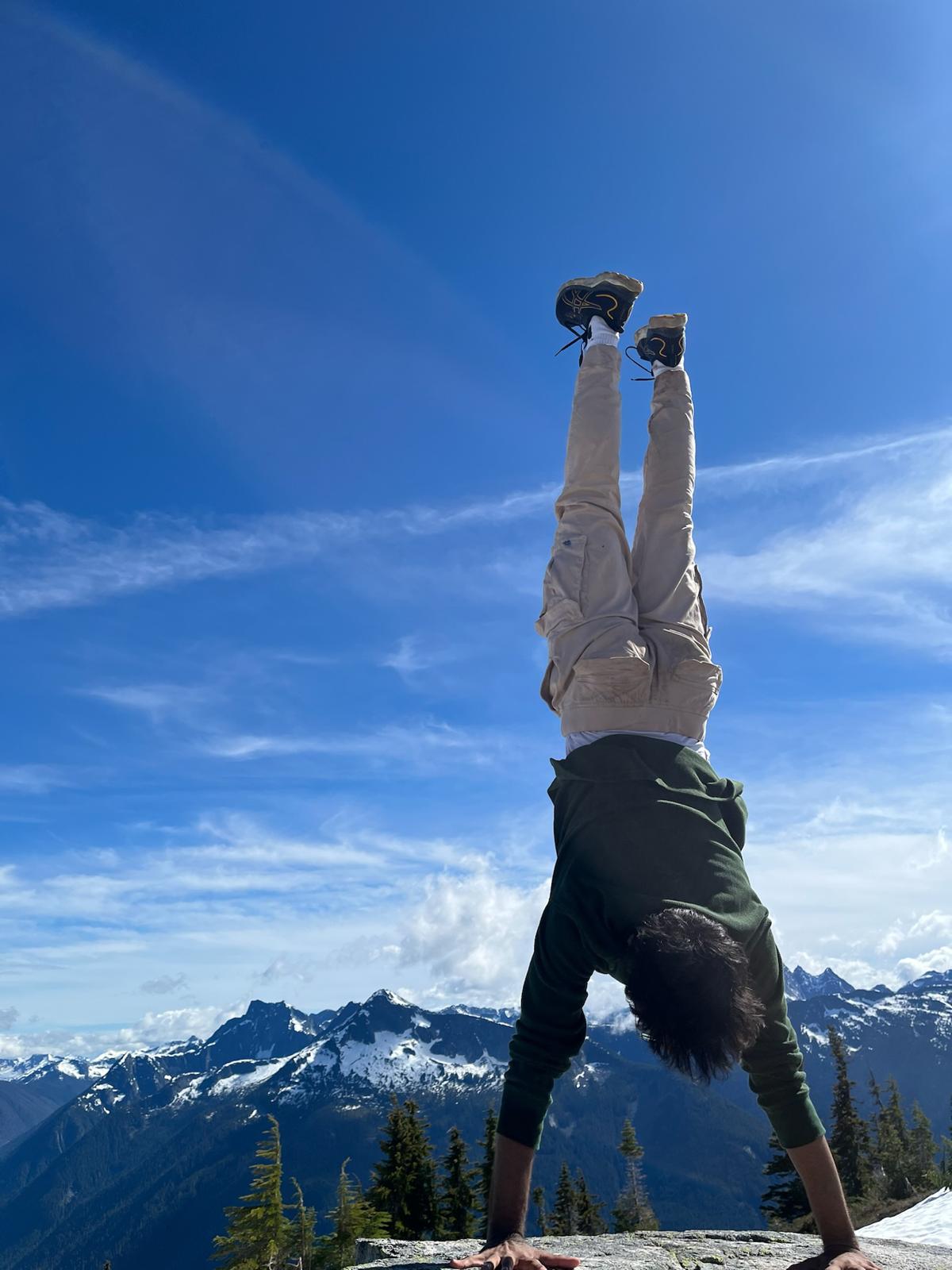 Parth doing handstand on Flora Peak